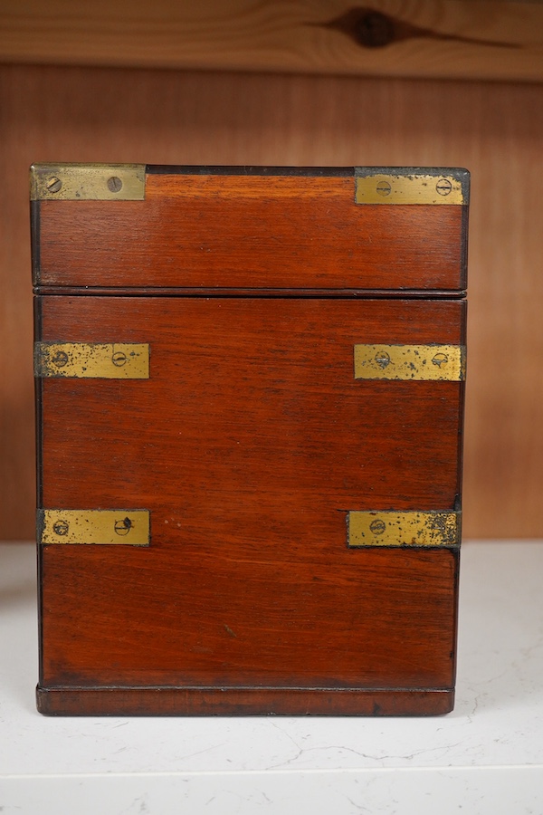 An early 19th century mahogany apothecary box, containing ten glass bottles, one with original paper label for the chemist Elam, 196 Oxford Street, London, with draw beneath containing a pair of scales, and weights, etc.